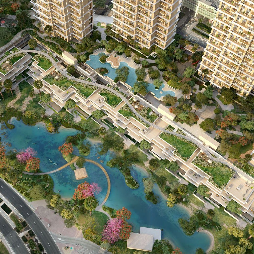 Overhead view of the lake, terraced townhouses and podium pool