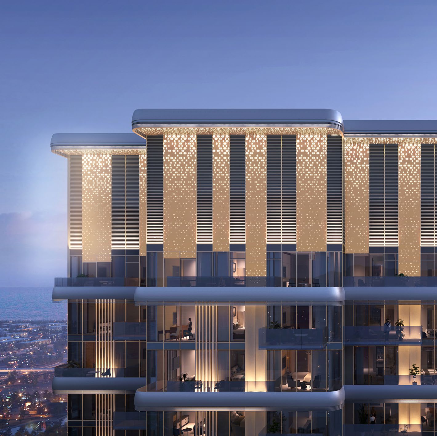 Tower crown glowing with starlight façade lighting at dusk